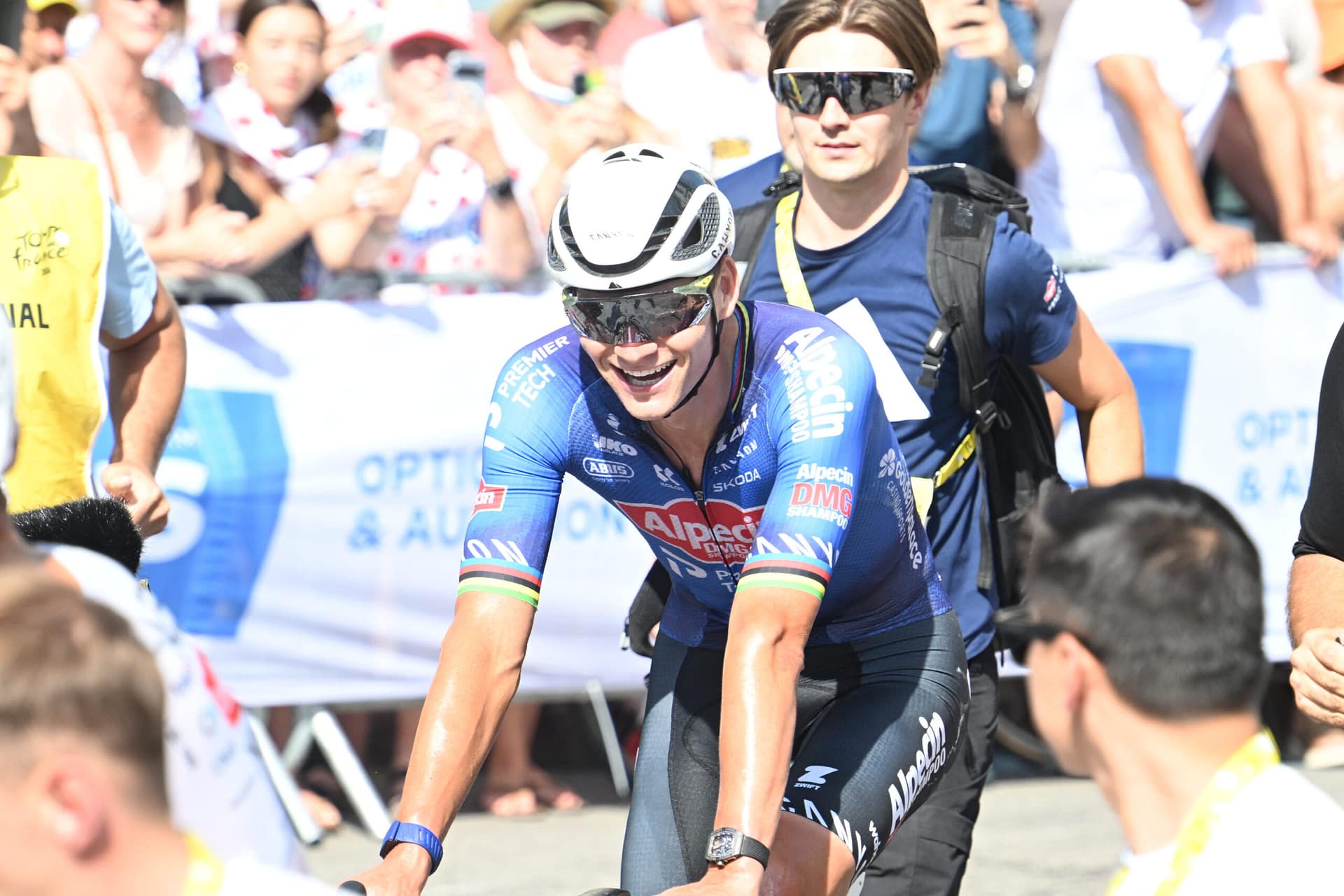 Mathieu van der Poel sprints downhill during Tour de France stage at Ussel, wearing Alpecin–Premier Tech kit